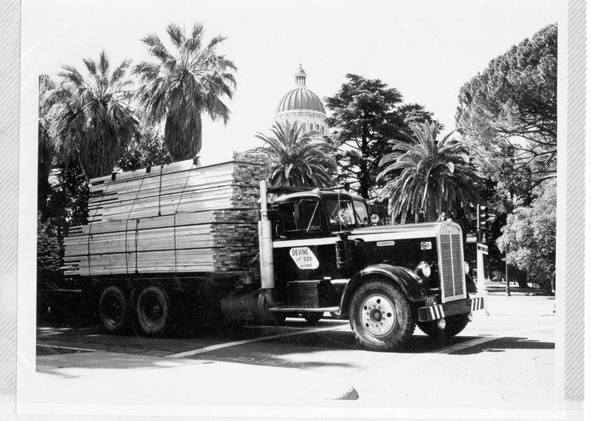 Old Devine Intermodal truck transporting lumber