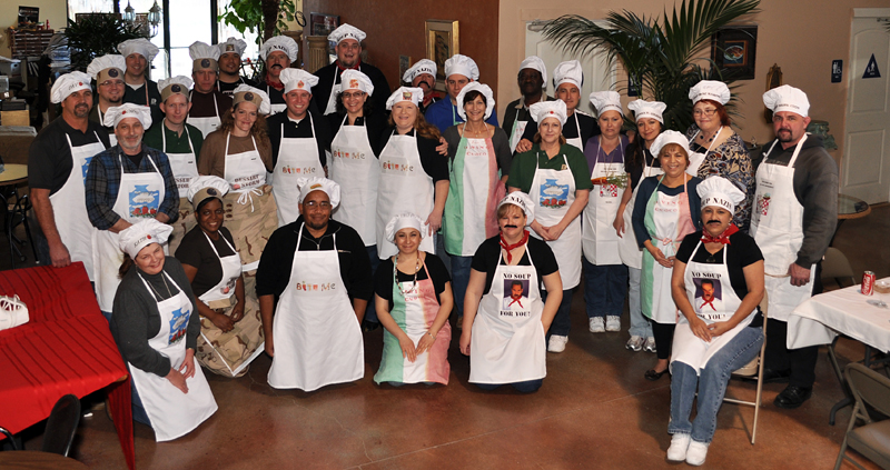 Staff with chefs hats and aprons