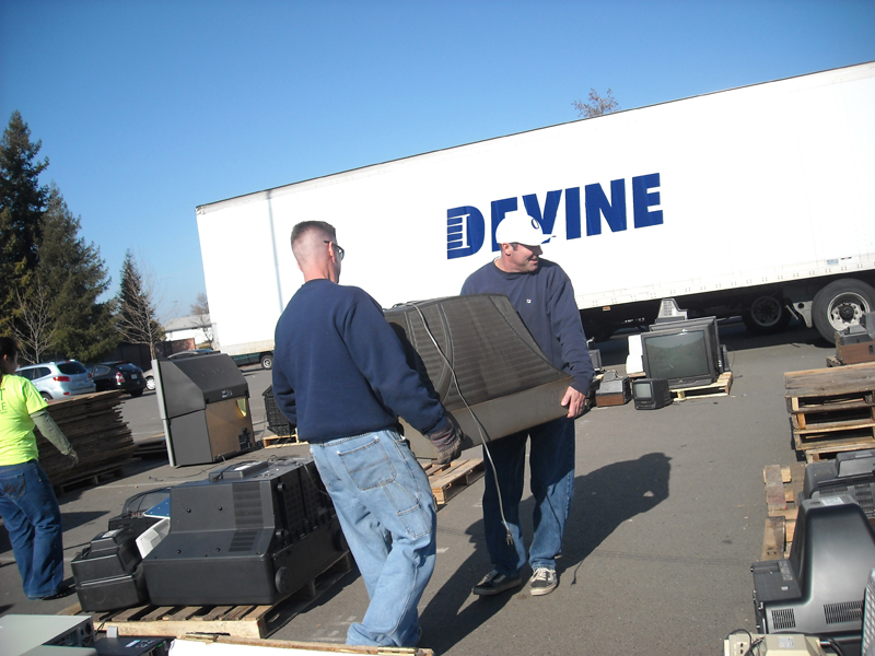 Volunteers helping move e-waste