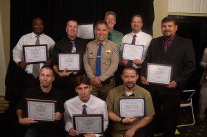 Back row l-r:  Jonathan Young, Scott Echols, Robert St. John, Mack Stone, Carlos Salguero.   Center:  Joe Farrow, California Highway Patrol Commissioner.   Front row l-r:  John Jackson, David Morgan, Mike Wynne.