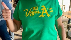 green shirt with yellow letters stating Las Vegas A's