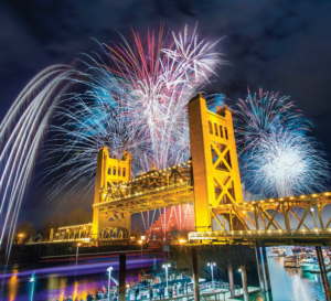 Picture of sacramento golden bridge, with 4th of july fireworks in the background.